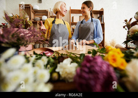 Two Women Working in Flower Shop Stock Photo