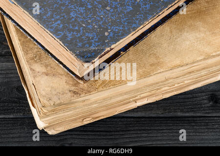 Two old books on the wooden table close up. literature, history, Knowledge and wisdom theme still life Stock Photo