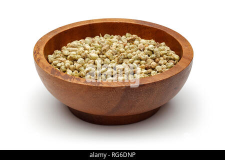Dried thyme in wooden bowl on white background Stock Photo