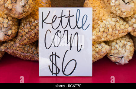 Bagged kettle corn for sale at a summer farmers market or fair. Stock Photo