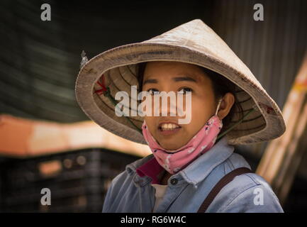 Traditional Vietnamese woman portrait wearing hat Stock Photo