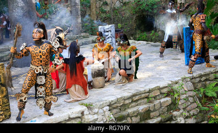 Pre-Hispanic Mayan amerindian people performance into the jungle in the ancient Mayan Village, Riviera Maya, Mexico Stock Photo