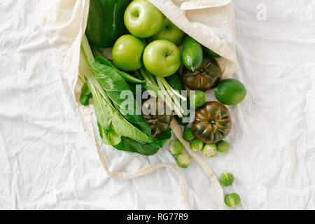 Fresh Organic Food Coming Out From Fabric Eco Shopping Bag, Top View, Flat Lay Stock Photo