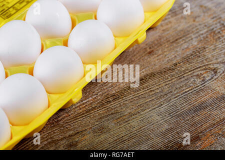 Chicken organic eggs in the cell egg yellow tray Stock Photo