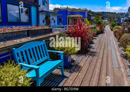 Colorful passage decorated with pot plants in a houseboats community in Sausalito, San Francisco bay, USA Stock Photo