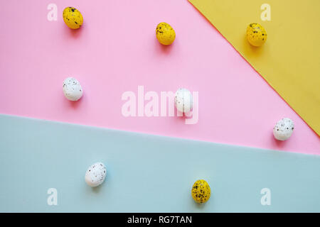 Many colored traditional quail Easter eggs on a colorful bright background. Easter celebration background. Stock Photo