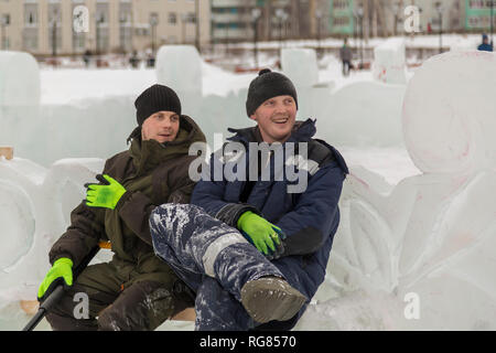 Two installers in a good mood on the site are talking Stock Photo