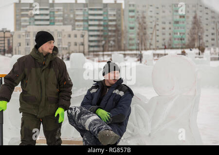 Two installers in a good mood on the site are talking Stock Photo
