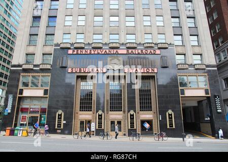 PHILADELPHIA, USA - JUNE 11, 2013: People walk by Pennsylvannia Railroad Suburban Station in Philadelphia. As of 2012 Philadelphia is the 5th most pop Stock Photo