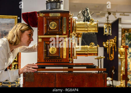 London,UK. 28th Jan 2019. A fine Riley brother Ltd bi-unial magic lantern, English, late 19th century, estimate £ 2,500 - 3,500 part of the  annual gentleman’s library sale at Bonhams Montpelier Street, Knightsbridge being held on 30th January 2019.  Credit: Claire Doherty/Alamy Live News Stock Photo