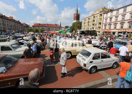BYTOM, POLAND - SEPTEMBER 12, 2015: People admire classic oldtimer cars during 12th Historic Vehicle Rally in Bytom. The annual vehicle parade is one  Stock Photo