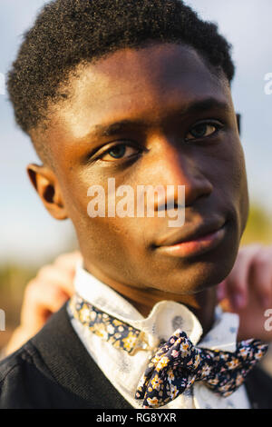 Portrait of a young black man, wearing a bow tie Stock Photo