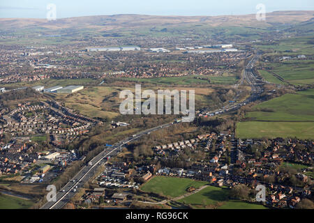 aerial view looking east along the M62 towards junction 20 from Castleton, north of Oldham, Greater Manchester Stock Photo