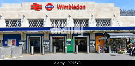 Sign & logo above public transport people entrance to Wimbledon national rail & London Underground train station & tramlink station London England UK Stock Photo