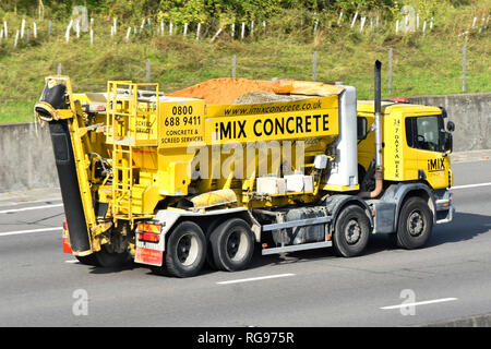 Side & back view yellow hgv building site concrete mixer & screed delivery lorry truck vehicle loaded with sand aggregate cement & water England UK Stock Photo