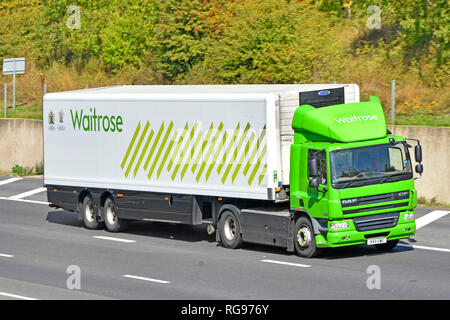 Side & front view Waitrose supermarket retail business food supply chain store delivery lorry truck & driver trailer logo & Royal Warrant England UK Stock Photo