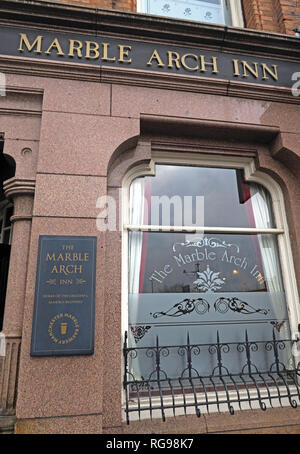 The Grade II listed Marble Arch Inn, Manchester, with its historic pub sign, sash window and decorative granite facade, Rochdale Road, M4 4HY Stock Photo
