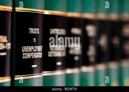 Legal law books on shelf with labels for learing understanding judicial case Stock Photo