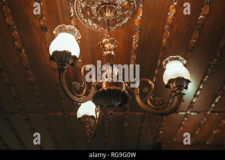 old vintage chandelier lamp on the ceiling in Dining room. Stock Photo