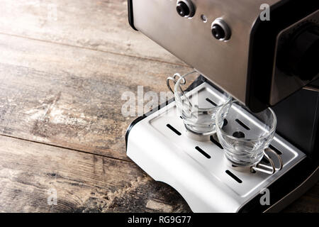 Espresso coffee machine with empty cup on wooden table Stock Photo