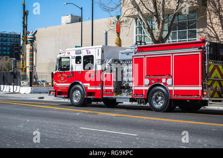 February 21, 2018 San Jose / CA / USA - Firetruck rushing down a street in downtown San Jose, south San Francisco bay area Stock Photo