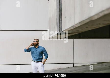 Bearded hipster businessman on the phone Stock Photo