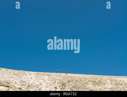 Mountaineers walking over empty plane Stock Photo