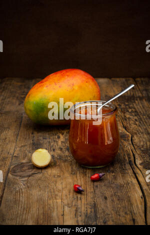 Glass of mango chutney with ginger and chili Stock Photo