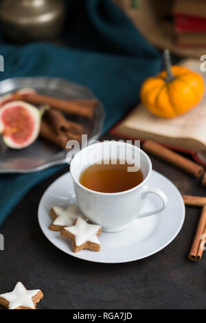 Cup of tea and cinnamon stars Stock Photo