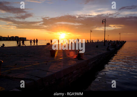 Italy, Friuli-Venezia Giulia, Trieste, pier at sunset Stock Photo
