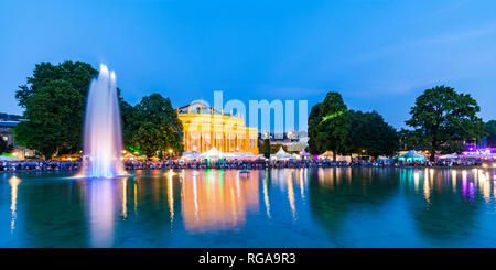 Germany, Stuttgart, palace garden, Eckensee, state theatre, opera house during summer party, blue hour Stock Photo