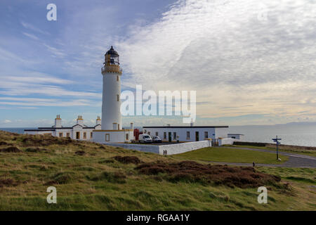 View of the compound surrounding the Mull of Galloway lighthouse in Dumfries and Galloway, Scotland, United Kingdom under a blue sky with white clouds Stock Photo