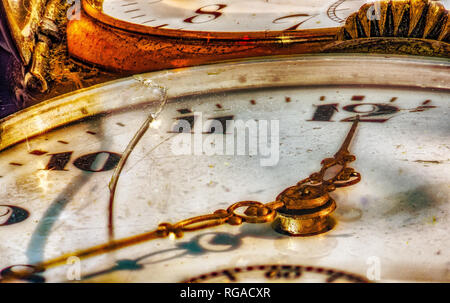 Still life color macro of ancient historic old pocket golden watches, symbolic,figurative, decay, fading,time,past,aging,age,carpe diem Stock Photo