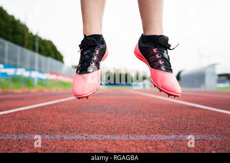 Feet of a jumping runner, mid air Stock Photo