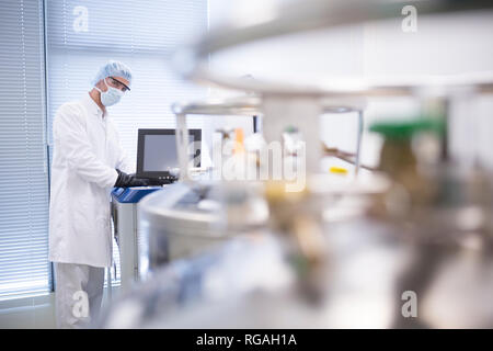 Scientist in lab with cryo store Stock Photo