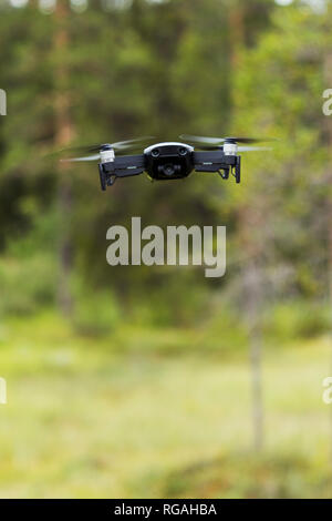Flying drone with camera Stock Photo