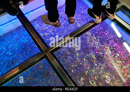 US coins displaying under glass floor at Money Museum of Federal Reserve Bank of Chicago. Illinois.USA Stock Photo