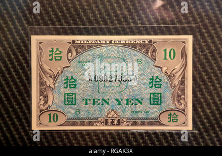 A 10 Yen military currency issued by Empire of Japan during World War II display at Money Museum in Federal Reserve Bank of Chicago. Illinois.USA Stock Photo