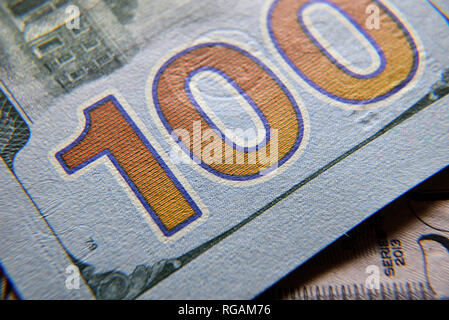 Dolar USA close up. Macro texture of a fragment of the dollar bill. USD banknote texture. One hundred American dollars macro. Stock Photo