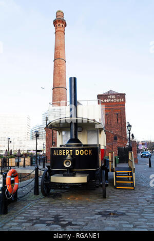 A steam engine at the Royal Albert Dock in Liverpool, England. The vehicle stands by The Pumphouse. Stock Photo