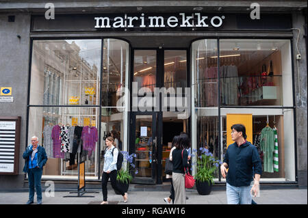 , Helsinki, Finland, Europe - Pedestrians walk past a shop of  Marimekko in a pedestrian zone in the city centre. [automated translation]  Stock Photo - Alamy