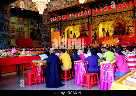 People praying inside Kek Lok Si, Air Itam, Penang, Malaysia Stock Photo