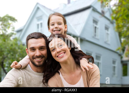 happy family over house background Stock Photo