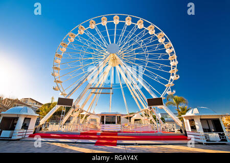 Giant Ferris wheel in Antibes colorful view, landmarks of French riviera, Alpes Maritimes department of France Stock Photo
