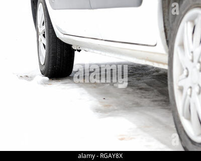 Winter car tires on winter road Stock Photo