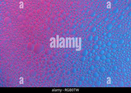 Abstract background of bubbles of foam colored gradient diagonally in blue and and purple colors Stock Photo