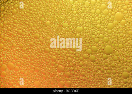 Abstract background of bubbles of foam colored gradient diagonally in yellow color Stock Photo