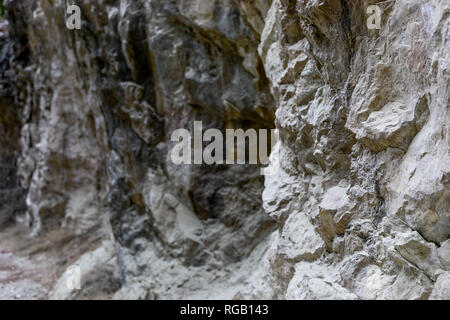 Natural stony background of part of rock formation with uneven surface.  Stock Photo