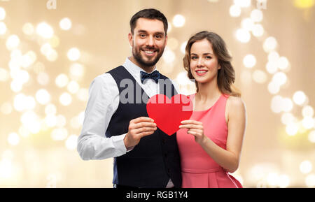 happy couple with red heart on valentines day Stock Photo