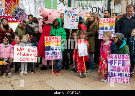 Parents and children stage a protest against the closure of Children's Centres on January 26, 2019 in Brixton's Windrush Square in Lambeth, London. Stock Photo